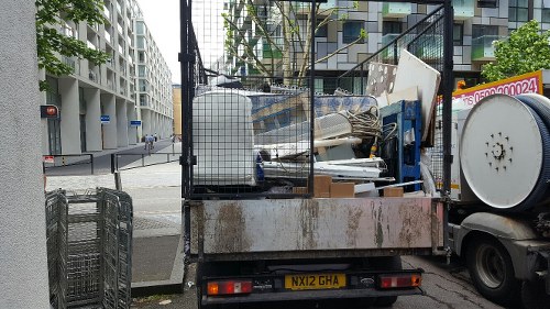 Before and after images of a loft clearance project in Willesden.